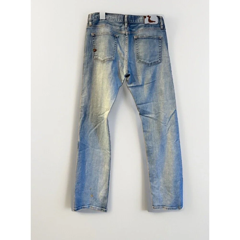 Jacob Davis medium-wash denim jeans featuring a distinct copper-toned 30x34